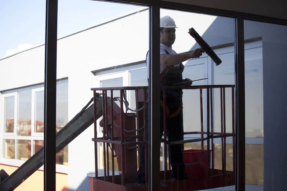 A professional cleaning window from the outside in Denver co